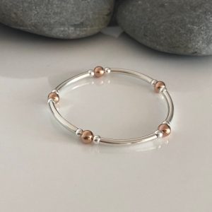 sterling silver and rose gold stretch bracelet 5e45b8f8 scaled